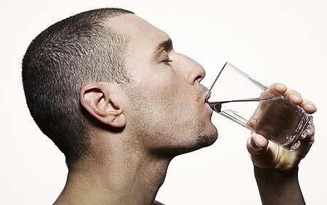 bodybuilder drinking distilled water