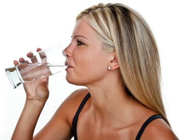 Woman drinking distilled water